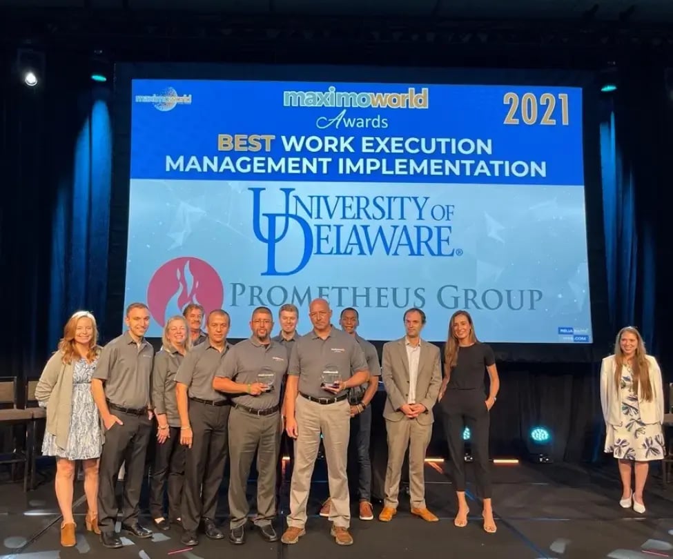 Prometheus Group accepting award for best work execution management implementation
