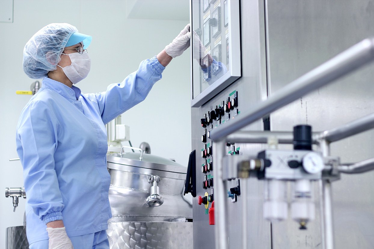 Pharmaceutical worker in factory