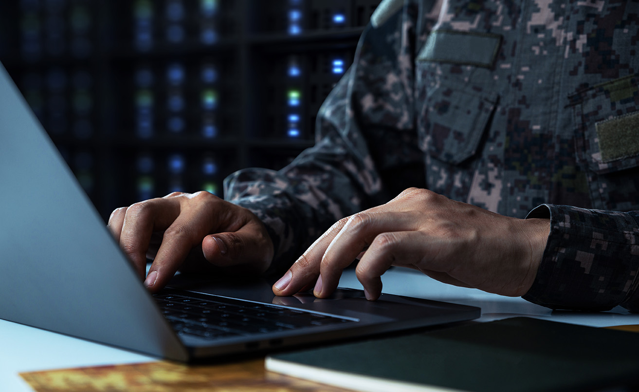 Military Man on computer