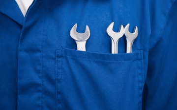 Three wrenches in the pocket of a maintenance worker 