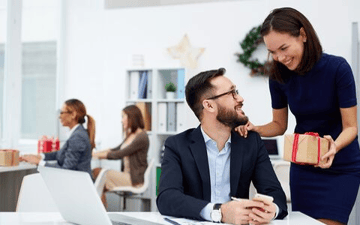 Office workers exchange gifts 