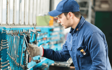 Worker selecting a wrench for work