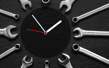 Wrenches surrounding a clock 
