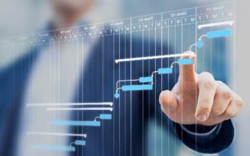 Hand reaches towards digital trend data