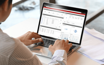 Office worker uses a computer to evaluate maintenance data 