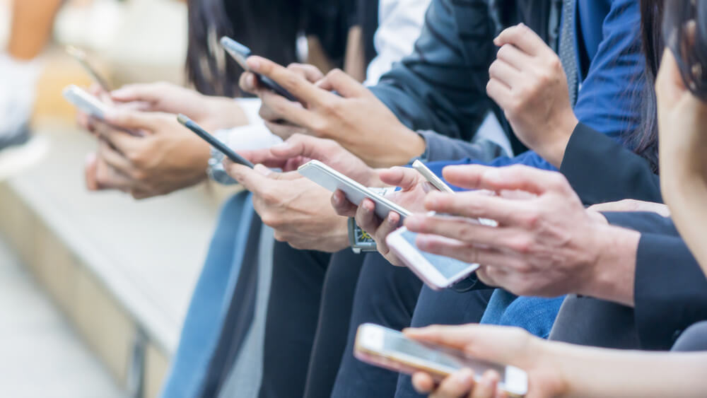 Crowd using mobile phones 