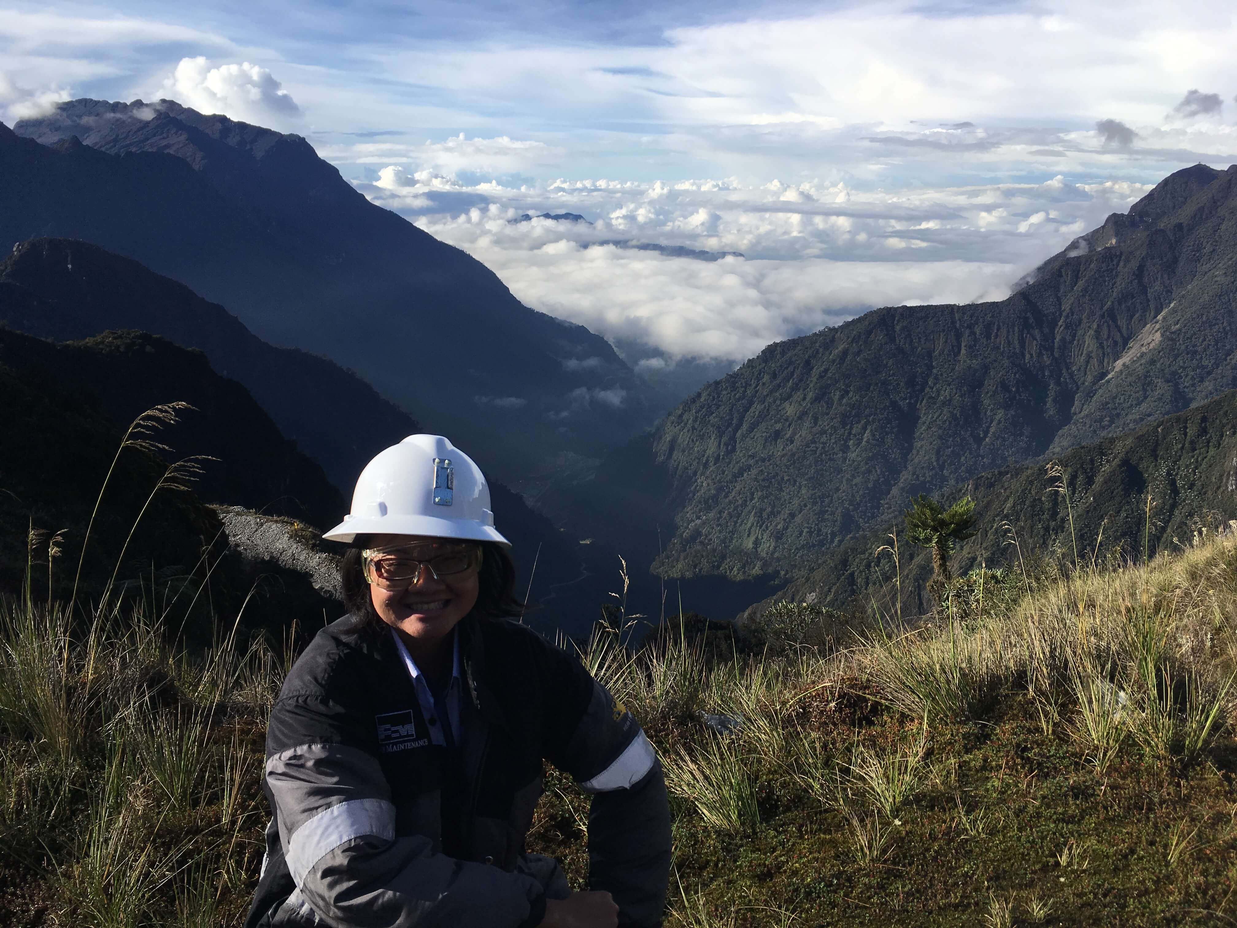 Lucia Prihandini in front of a mountain range 