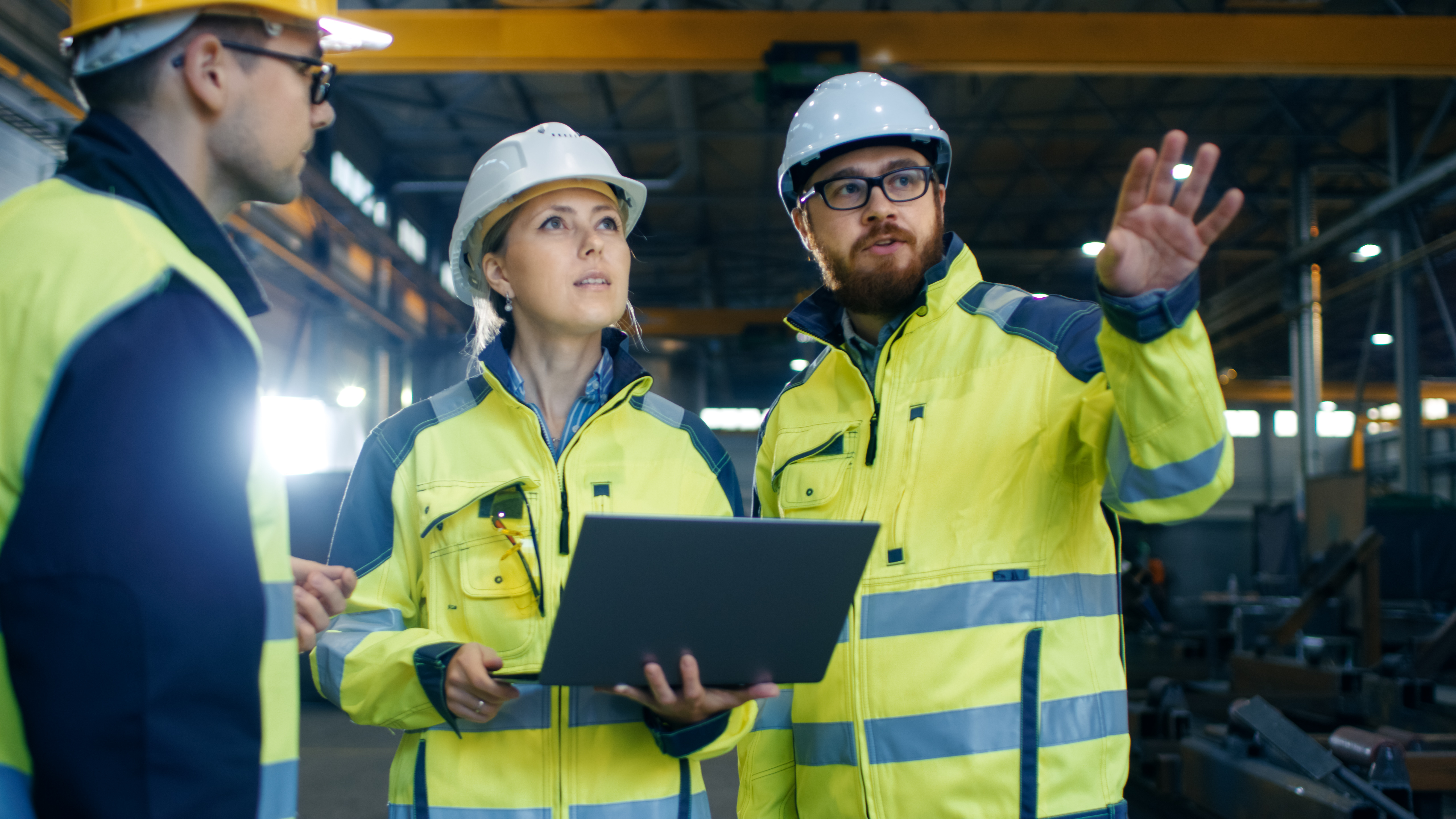 3 workers looking at a jobsite