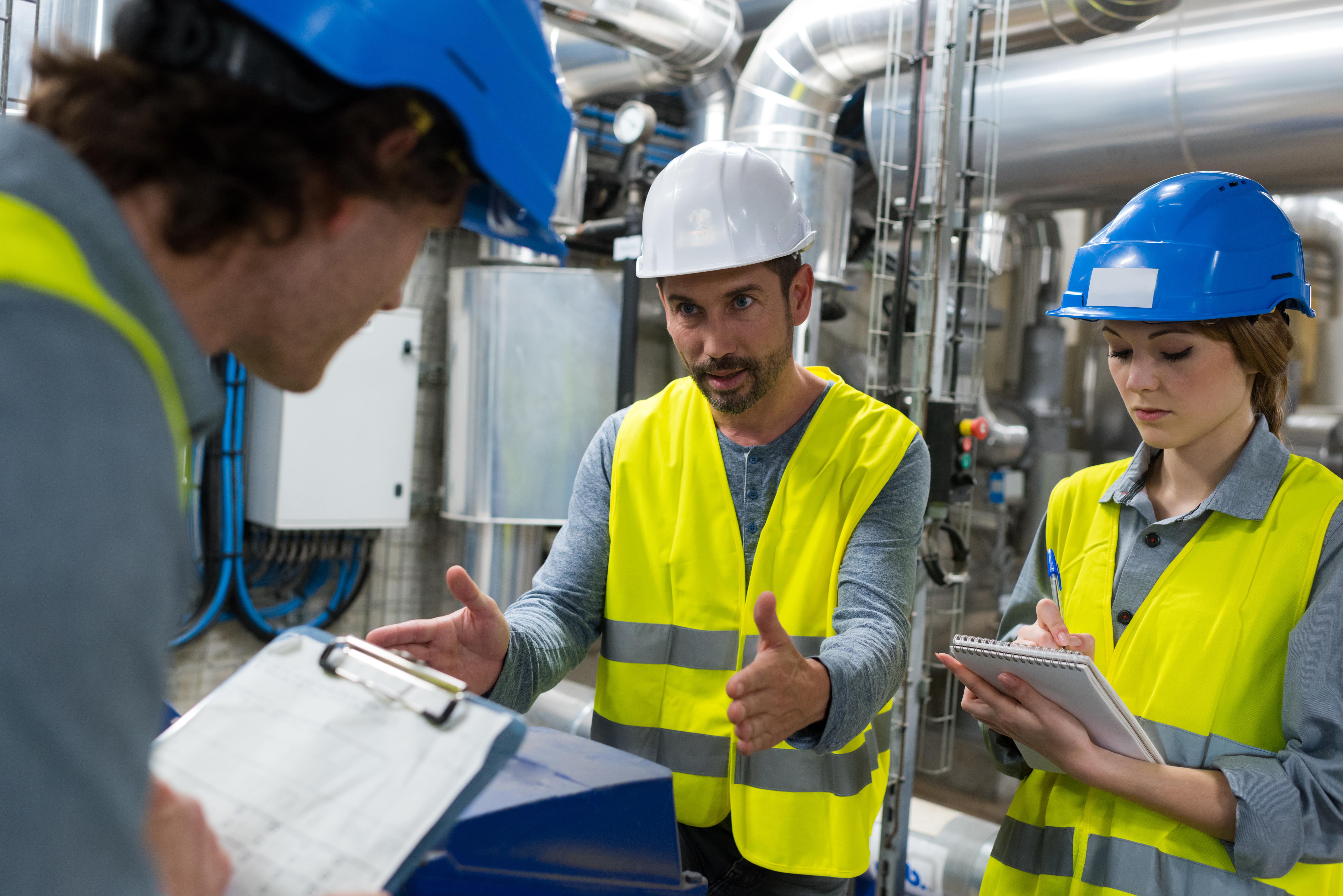 Maintenance crew discussing plans for a shutdown